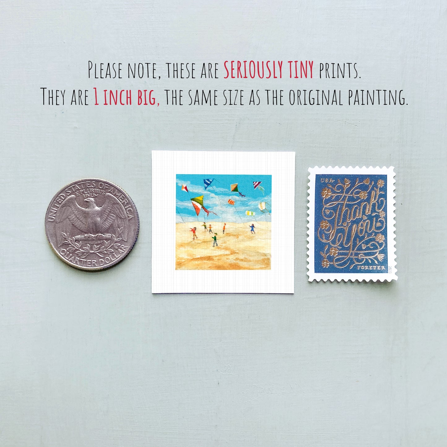 three small prints: a quarter, a postage stamp, and a painting of kites.