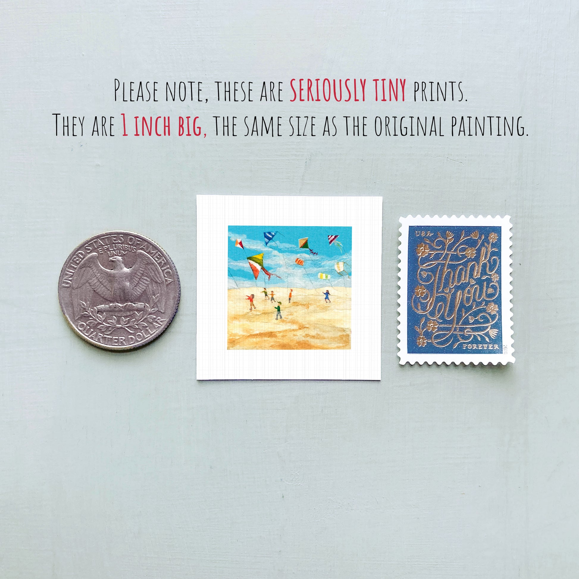 three small prints: a quarter, a postage stamp, and a painting of kites.