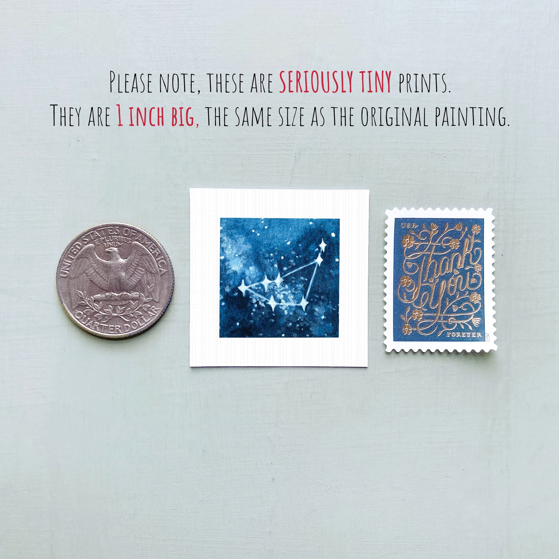 three small prints: a quarter, a square print with a blue background depicting a starry night sky, and a postage stamp.