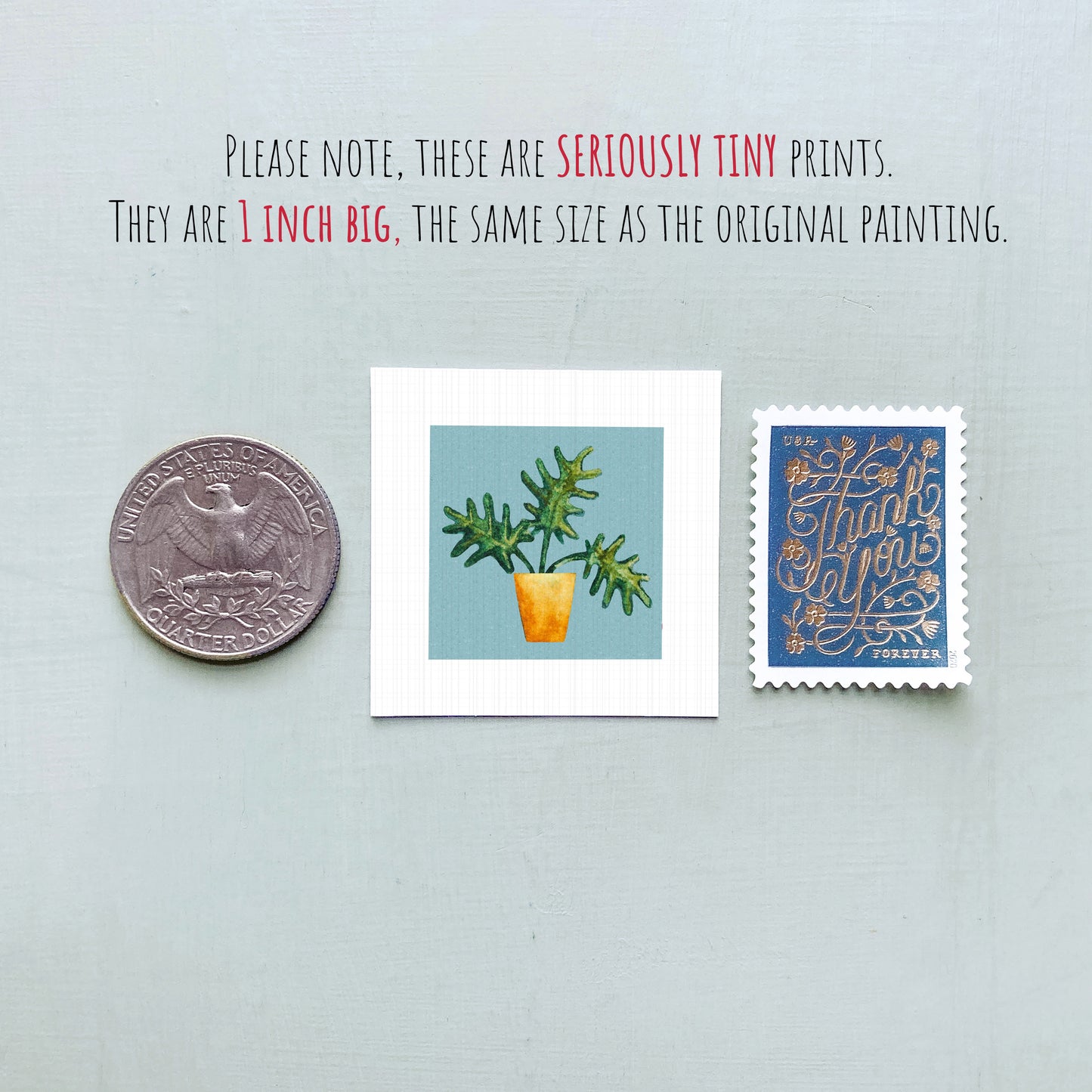 three small prints: a silver coin, a square print of a plant, and a blue postage stamp.