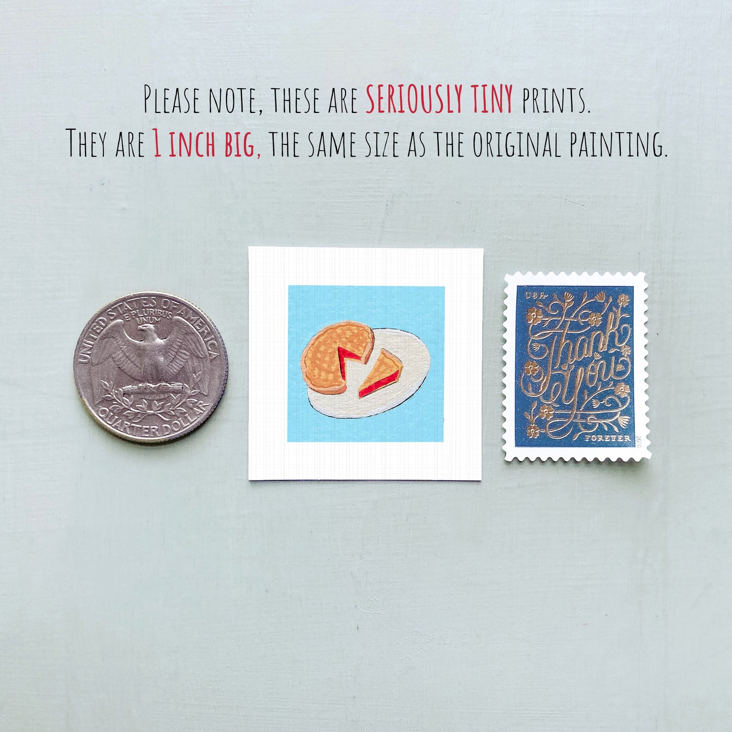 three tiny prints: a quarter, a postage stamp, and a piece of paper with a drawing of a pie.