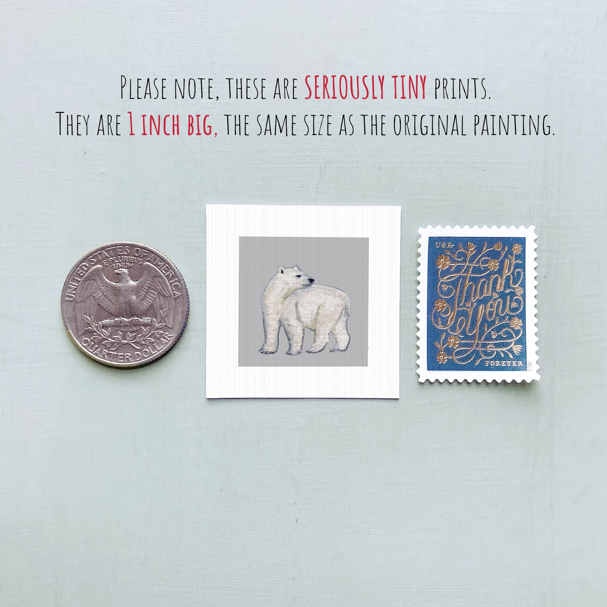three small items: a quarter, a polar bear illustration, and a postage stamp.