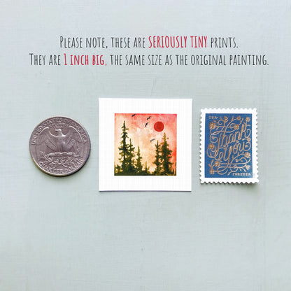 three small prints: a United States quarter, a square print of a landscape with a red sun, and a blue postage stamp with gold lettering.