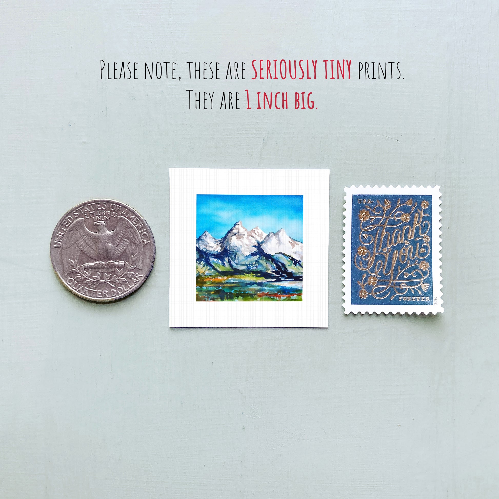 a collection of three small prints, including a coin, a postcard, and a stamp, all of which are described as "seriously tiny prints" and "1 inch big".
