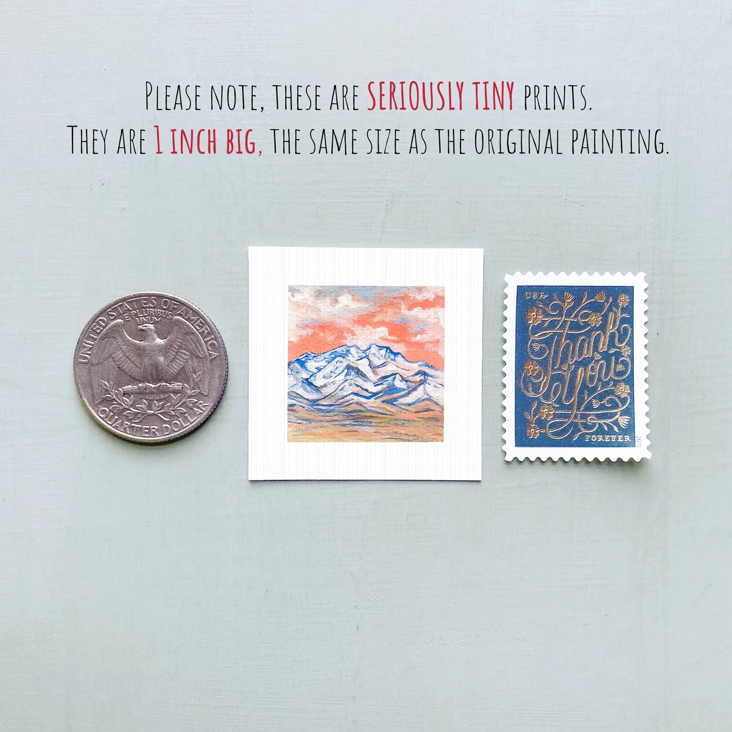 three small artworks or prints, including a coin, a postcard, and a painting, all of which are described as "seriously tiny prints" and "1 inch big" in the provided text.