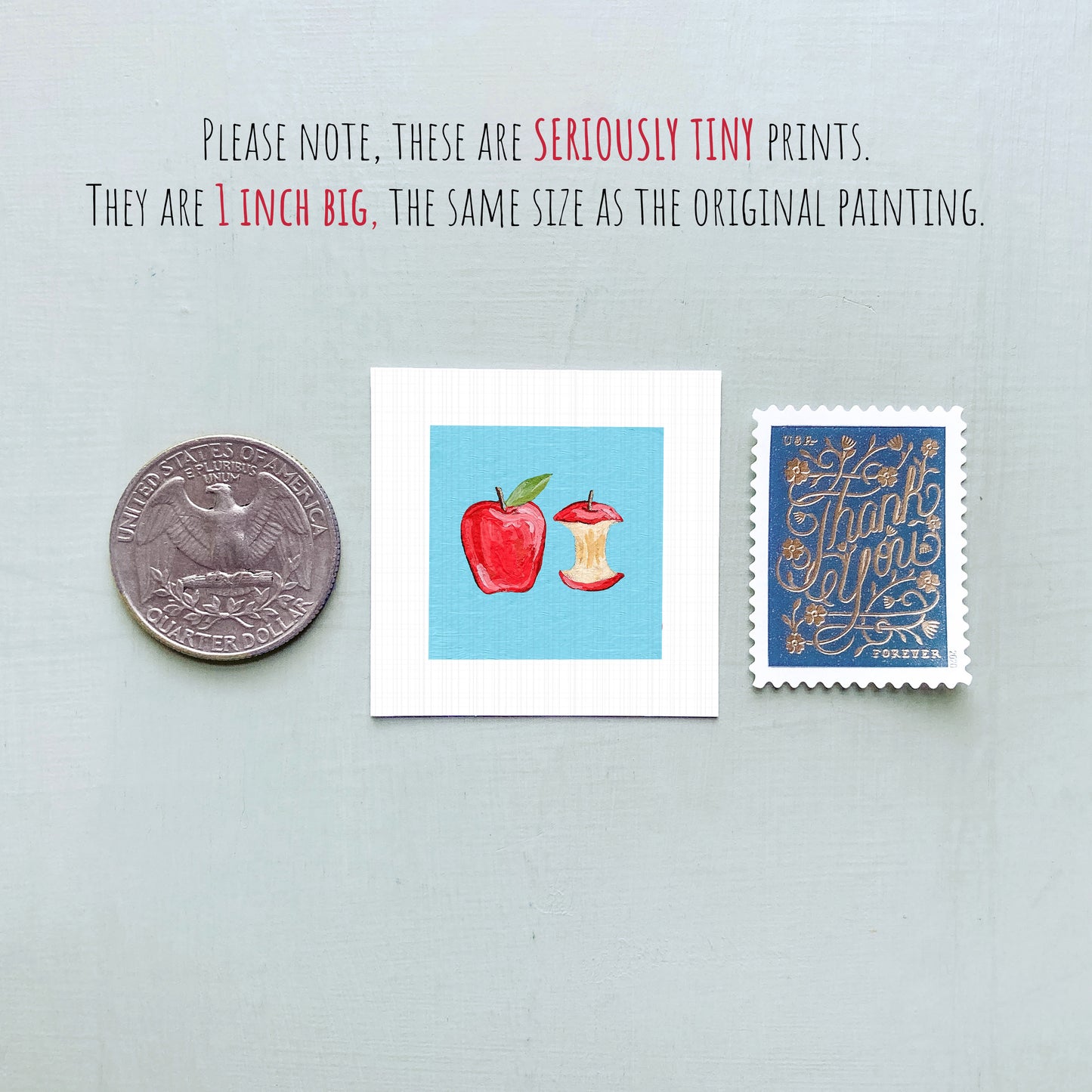 three small prints: a United States quarter, a small square print with an apple and an apple core, and a blue postage stamp with gold lettering.