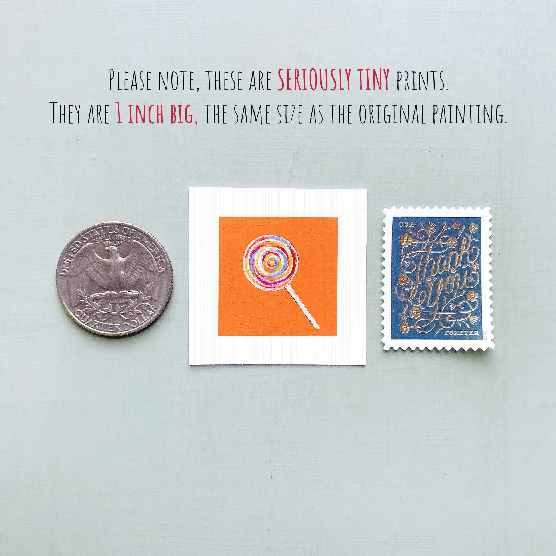 three small, tiny prints: a United States quarter, a small square print with an orange background and a lollipop illustration, and a blue postage stamp with gold lettering.