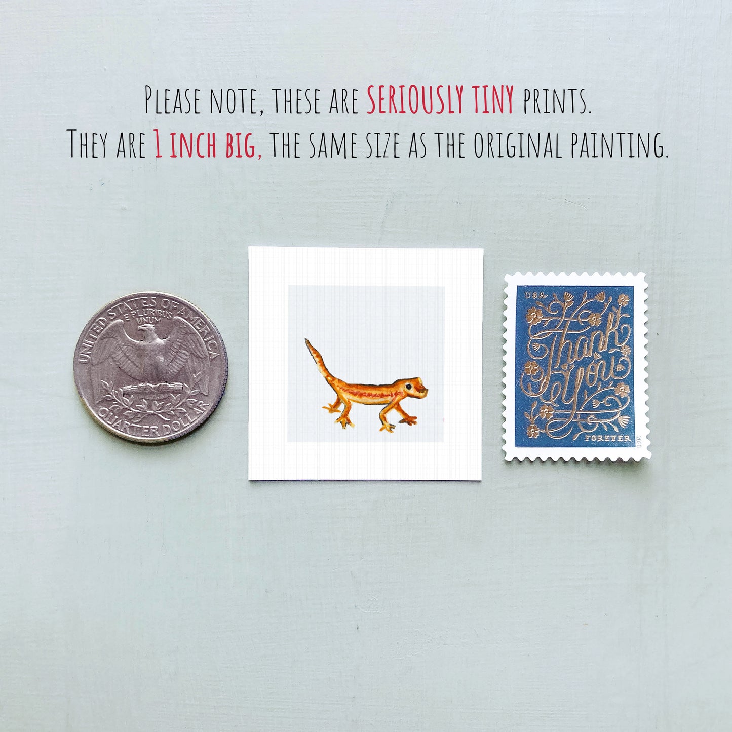 three small, seriously tiny prints: a quarter, a square print of a lizard, and a postage stamp.