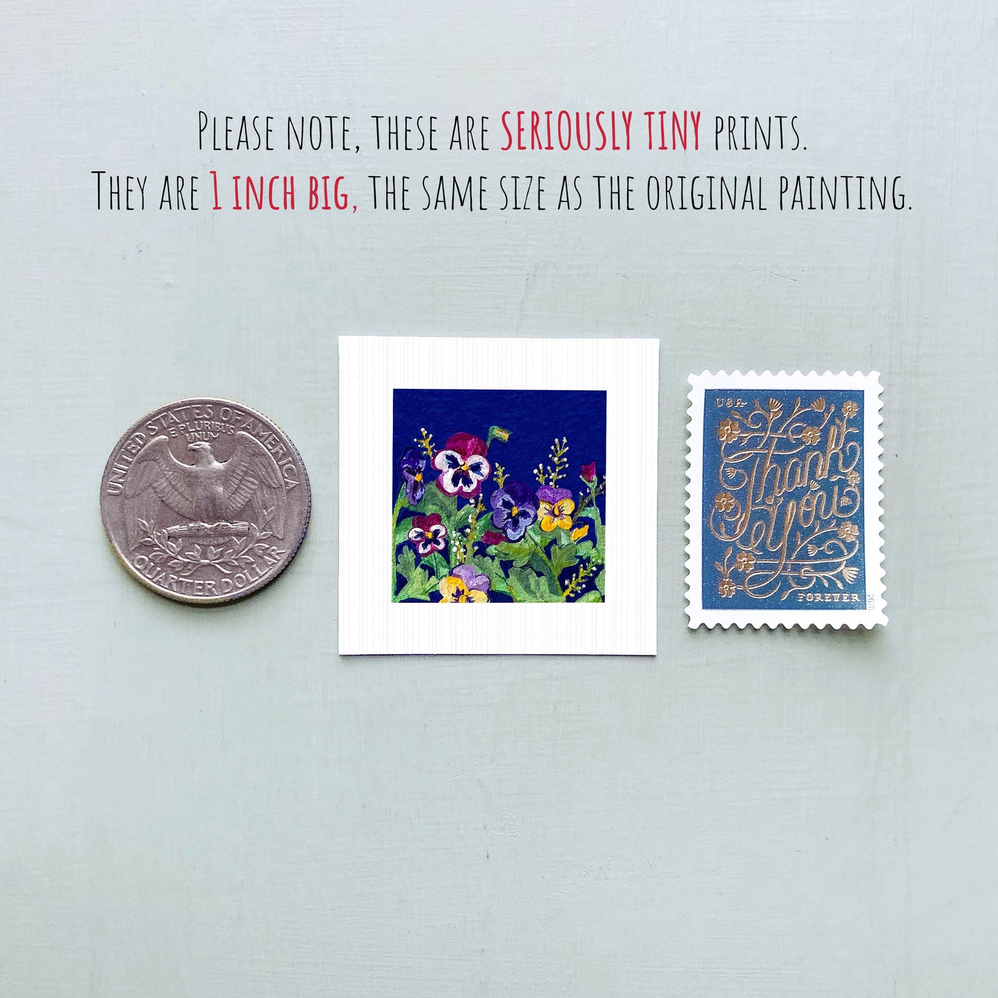 three small artworks: a silver coin, a white square with a colorful floral painting, and a blue postage stamp with gold lettering.