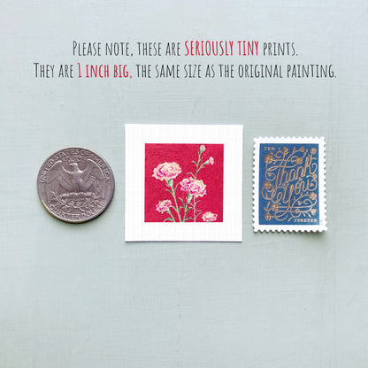 three small prints: a silver coin, a red square with pink flowers, and a blue postage stamp.