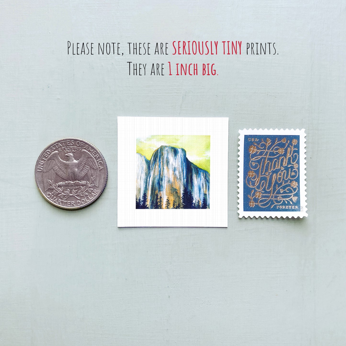 a collection of three small items: a quarter, a postage stamp, and a postcard.