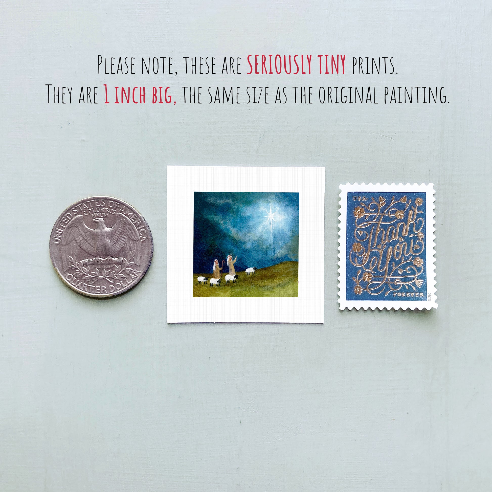 three small art prints and a United States quarter coin, all of which are 1 inch in size, as described in the text.