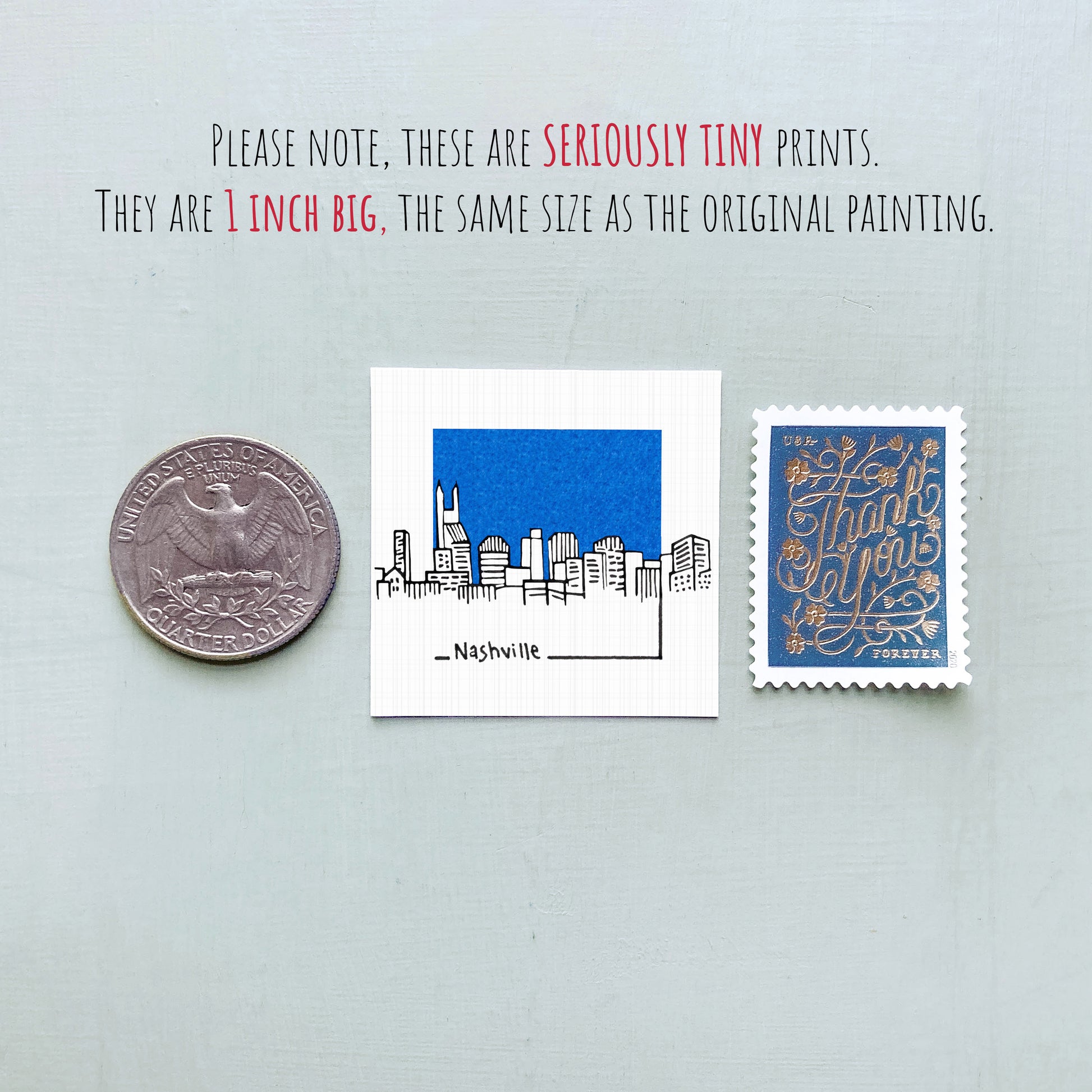 three different objects: a quarter, a small square print with a cityscape illustration, and a postage stamp.