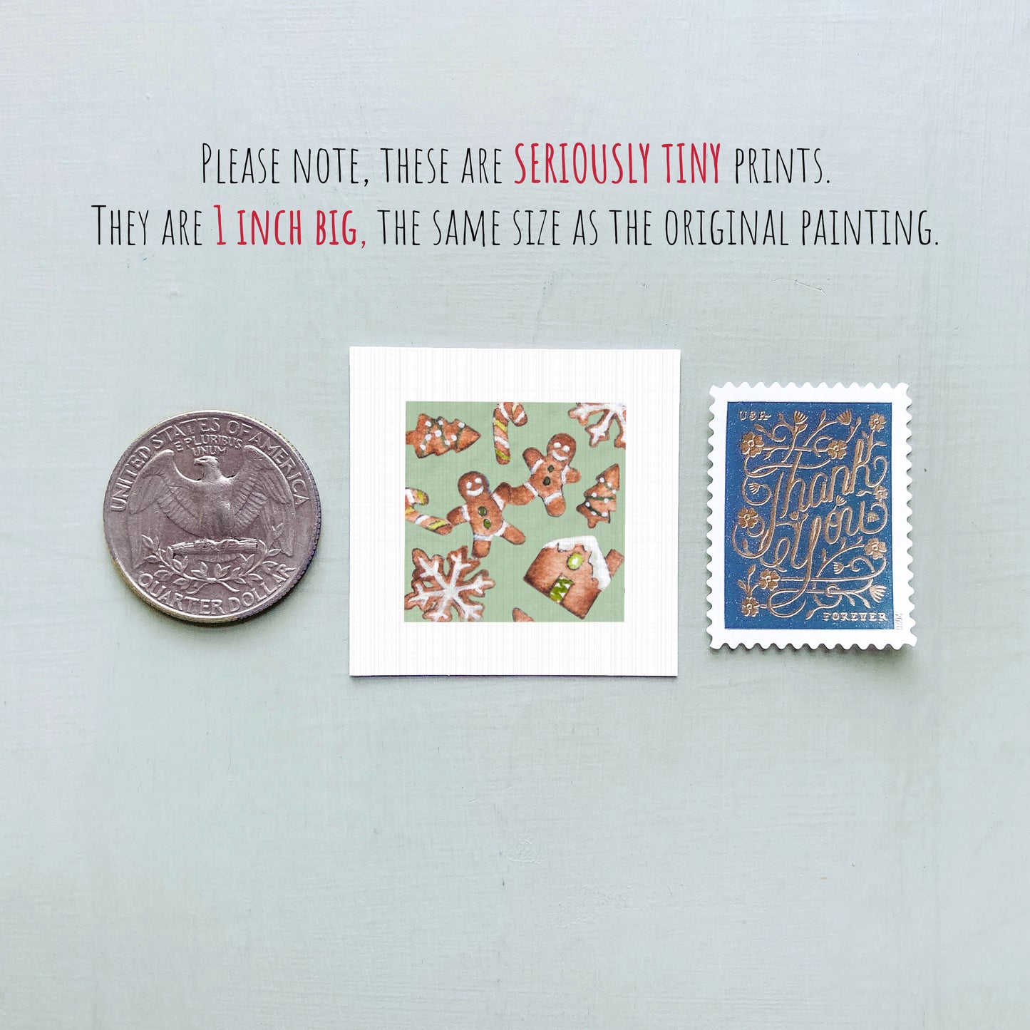 three small prints: a silver coin, a square print with gingerbread men, and a blue postage stamp.