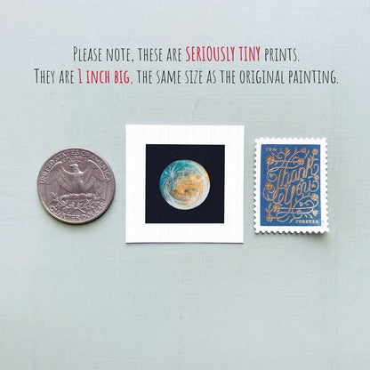 three small prints: a quarter, a square print with a blue background, and a postage stamp.