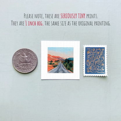 three small artworks: a coin, a postage stamp, and a painting of a road.