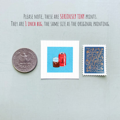 three small, seriously tiny prints: a quarter, a blue square with a red can and glass illustration, and a blue postage stamp with gold lettering.