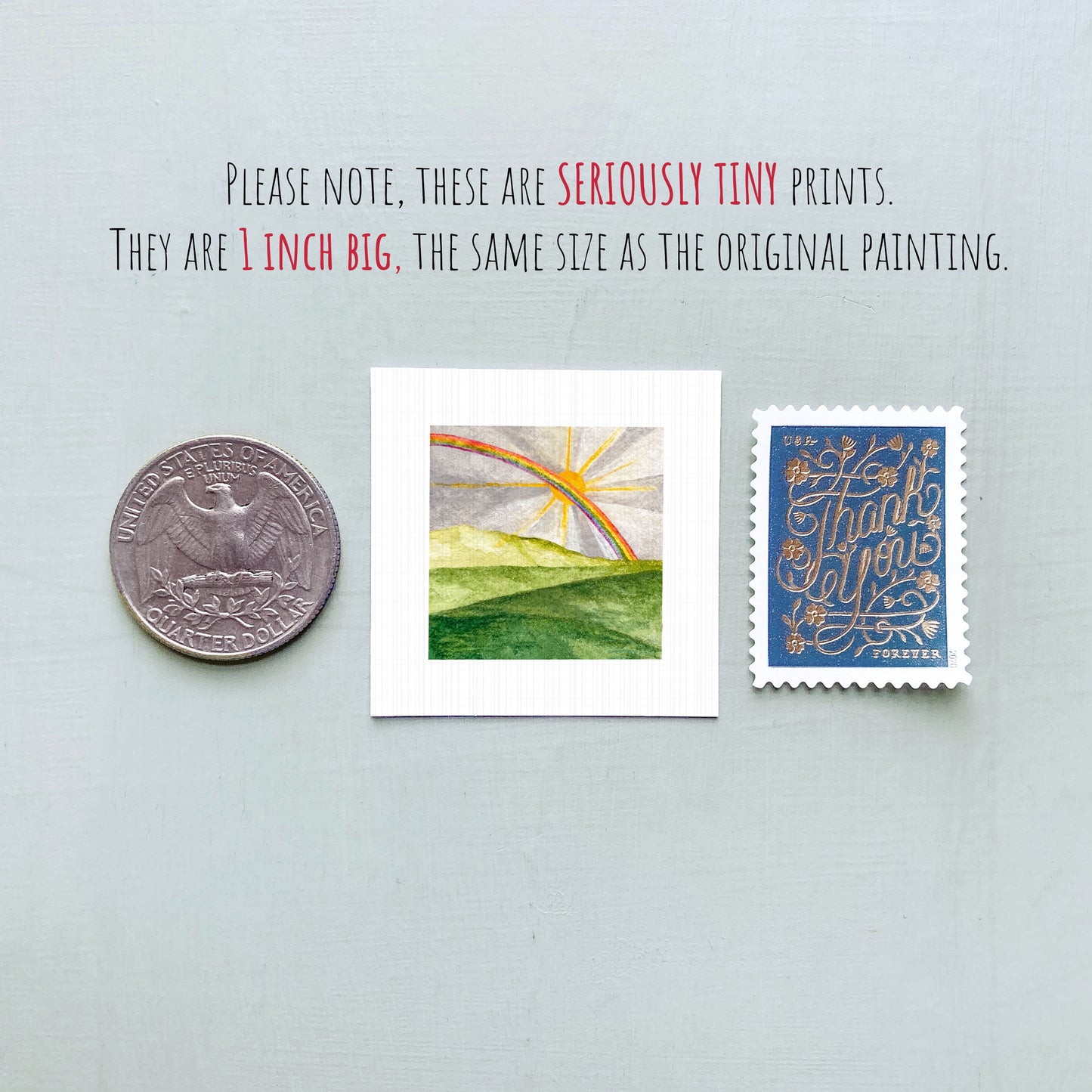 three small prints: a quarter, a square print with a landscape, and a postage stamp.