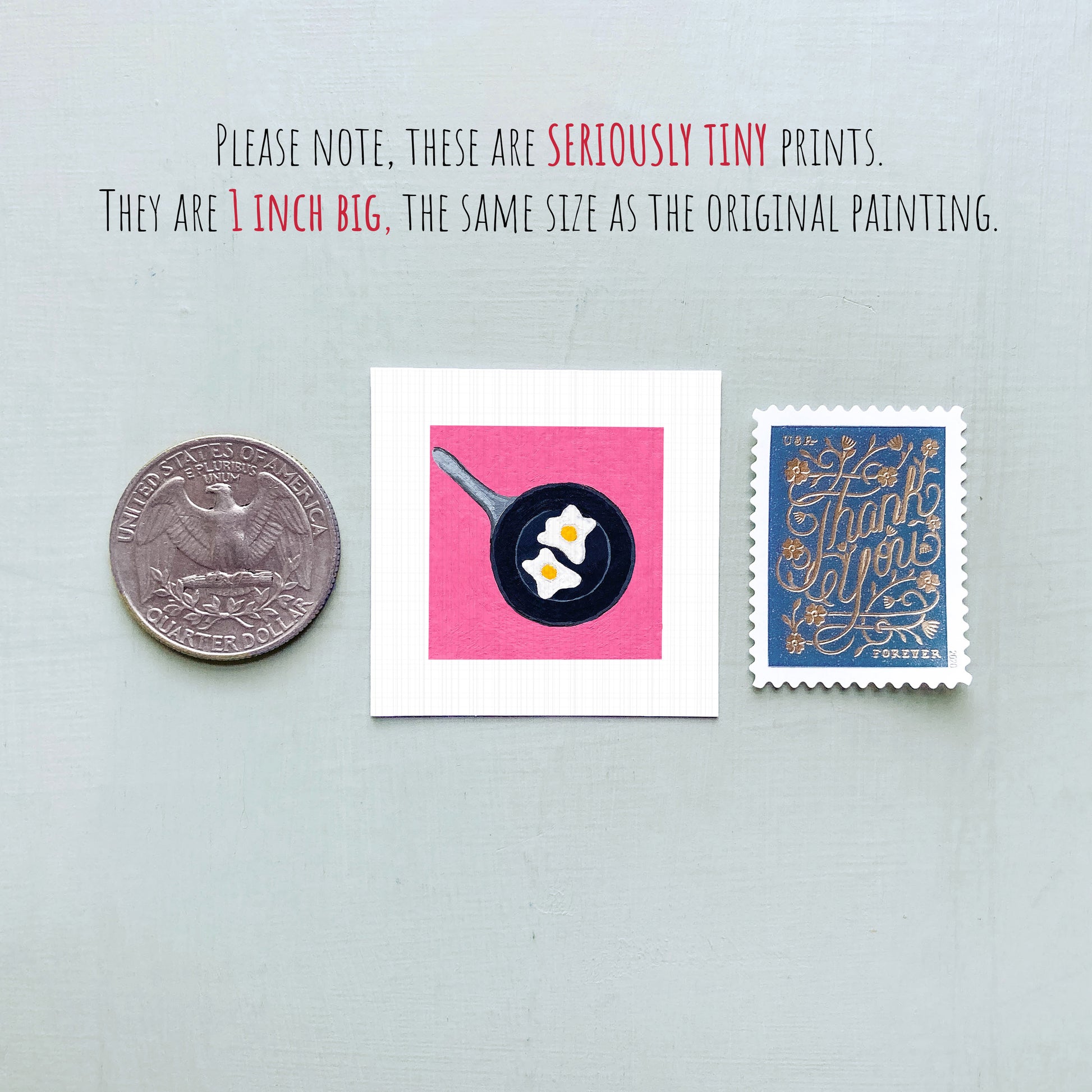 three small objects: a United States quarter, a square with a frying pan and eggs, and a blue postage stamp with gold lettering.