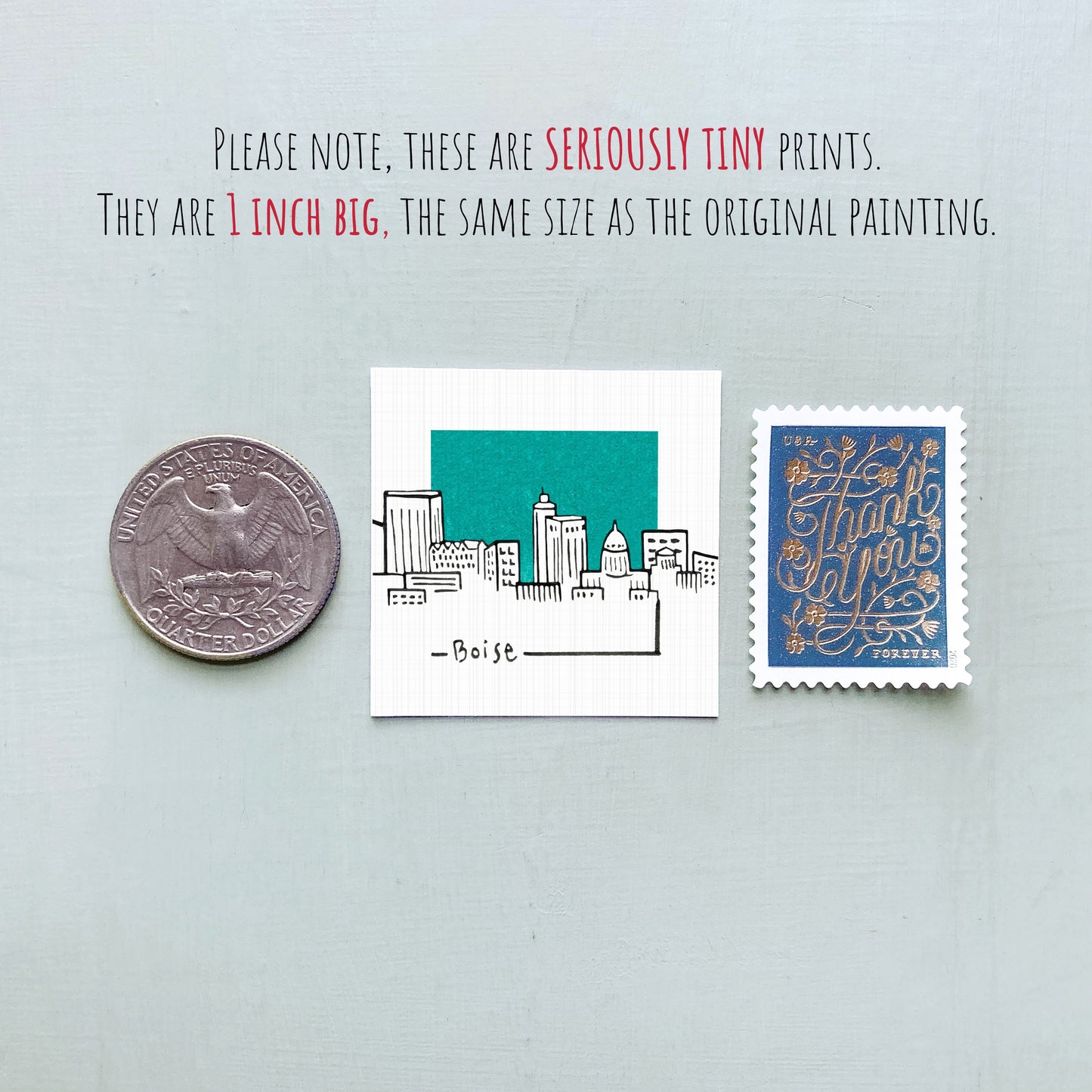 a collection of three small items: a quarter, a square with a drawing of a city, and a postage stamp.
