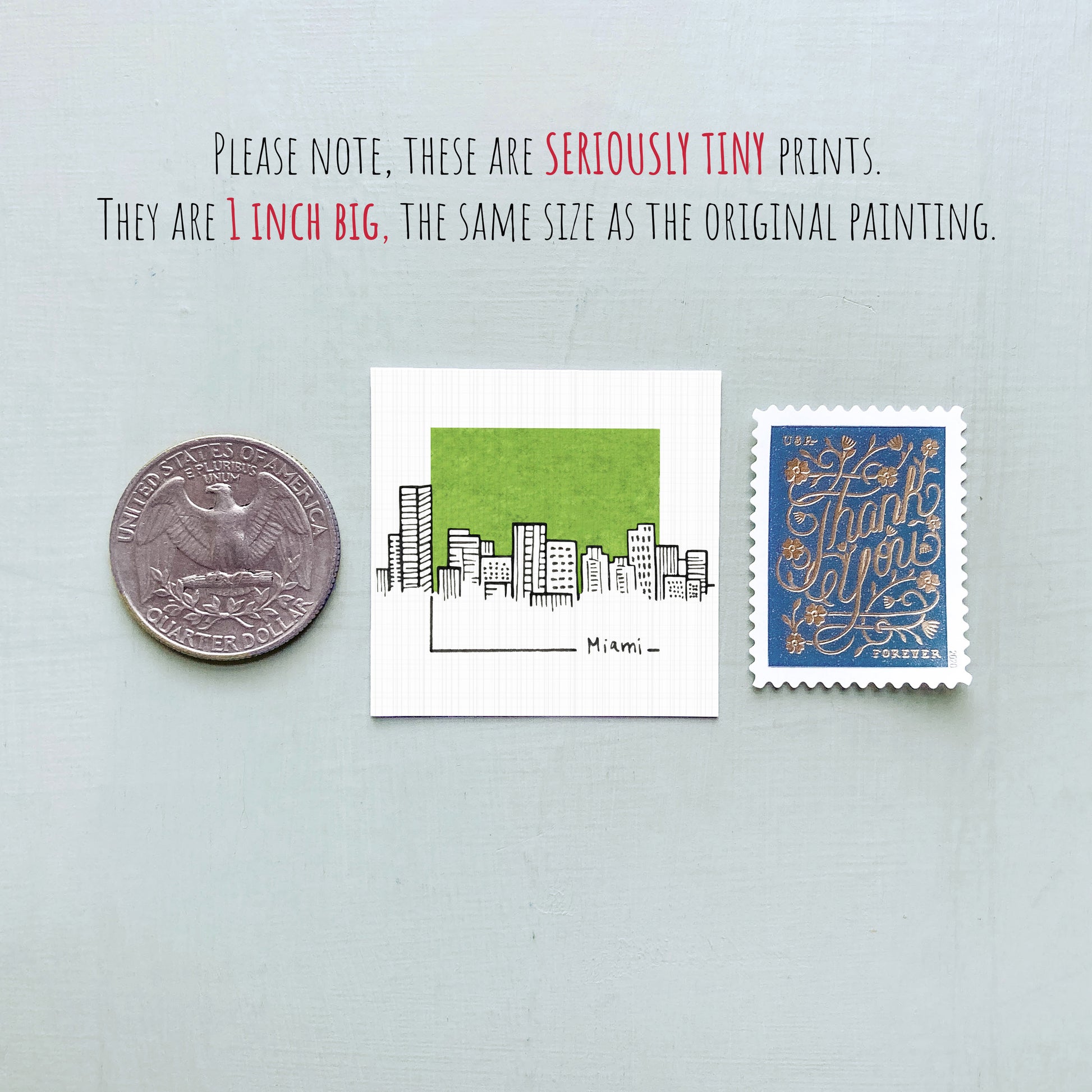 three different objects: a United States quarter, a small square print with a cityscape illustration, and a blue postage stamp.