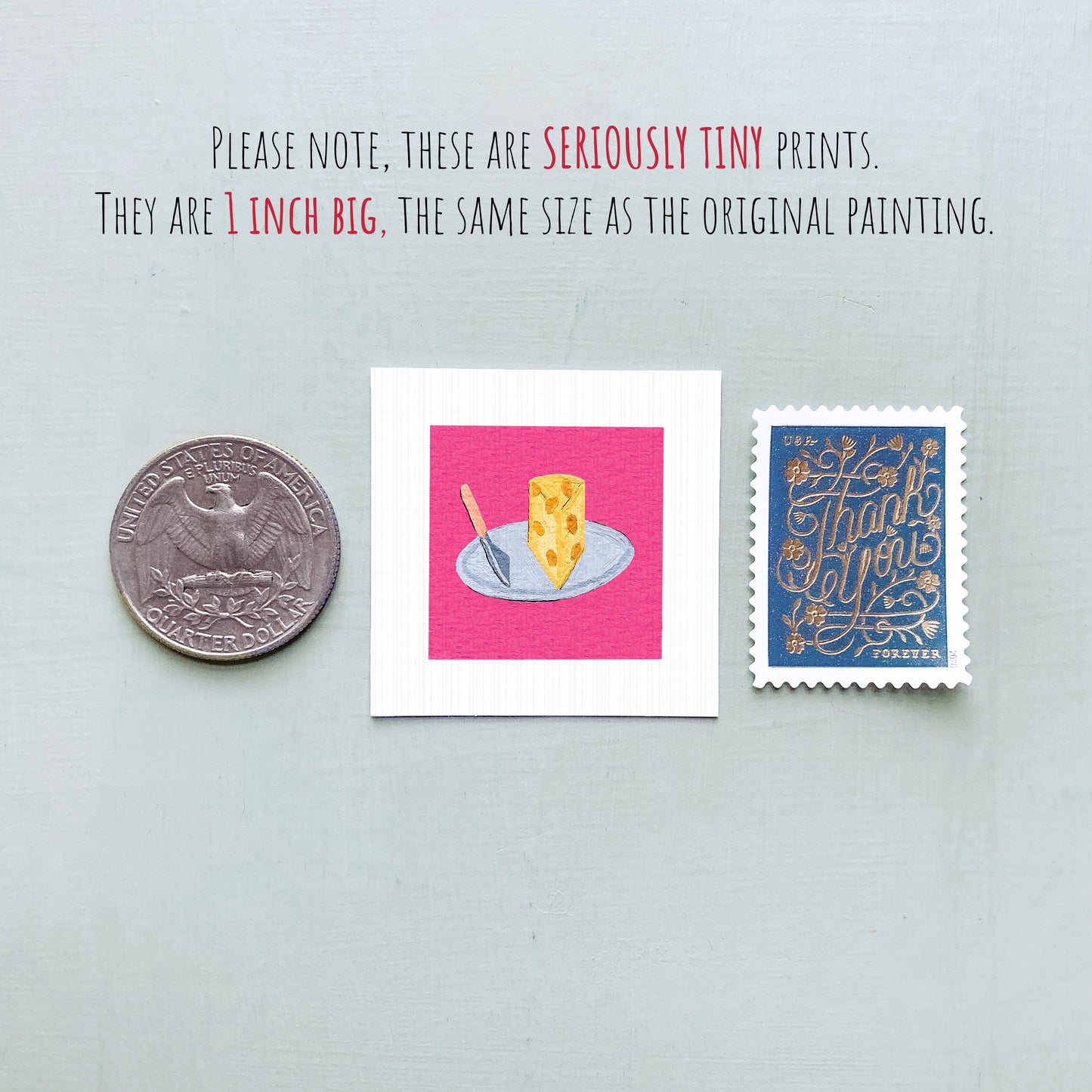 three small items: a quarter, a piece of paper with a drawing of a slice of cheese on a plate, and a postage stamp.