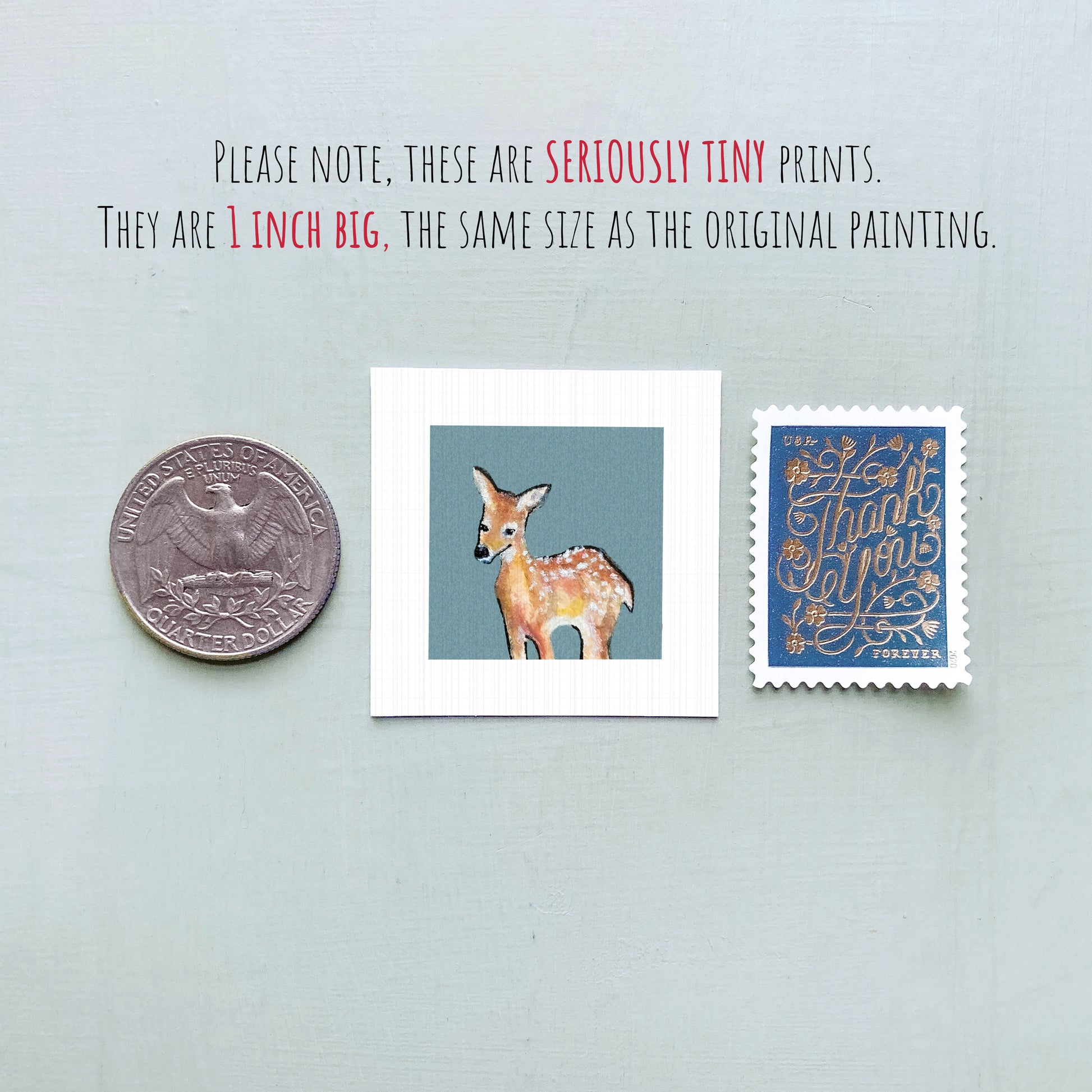 a collection of three small items: a quarter, a square print of a deer, and a postage stamp.