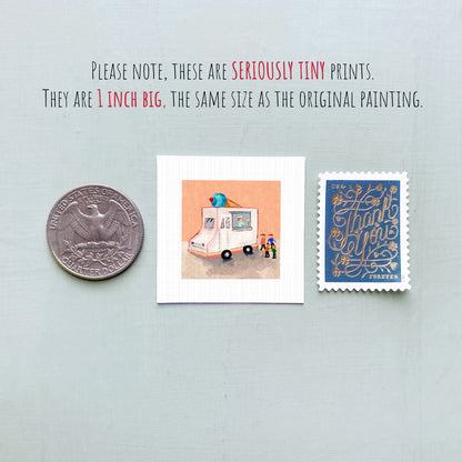 three small prints: a United States quarter, a small square print with an illustration of a truck and people, and a blue postage stamp with gold lettering.