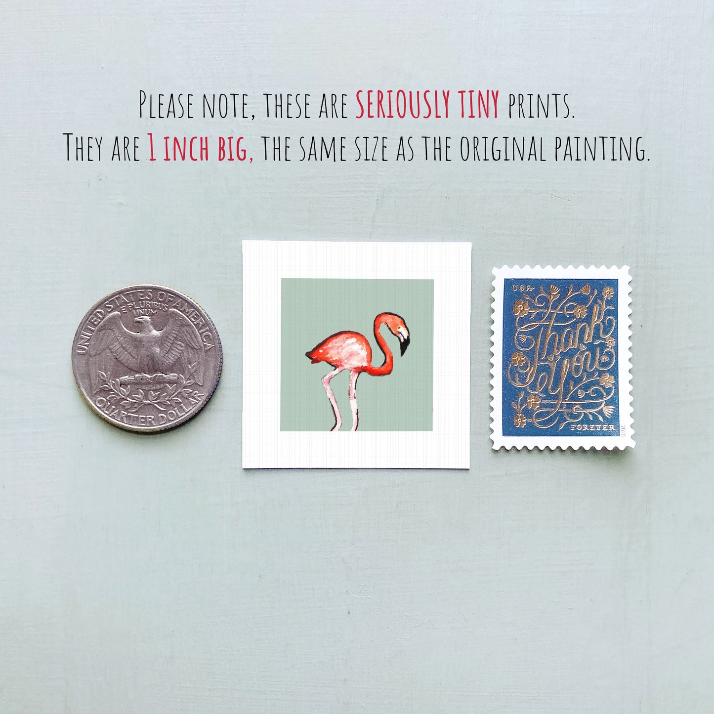 three small artworks: a silver coin, a framed print of a flamingo, and a blue postage stamp.