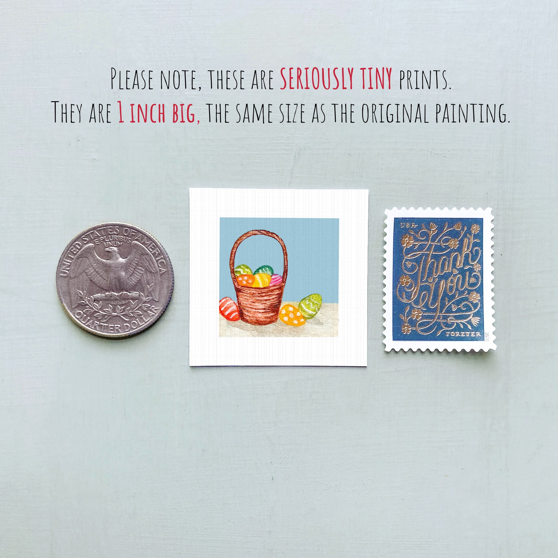 three small prints: a silver coin, a white square print of a basket of Easter eggs, and a blue postage stamp.