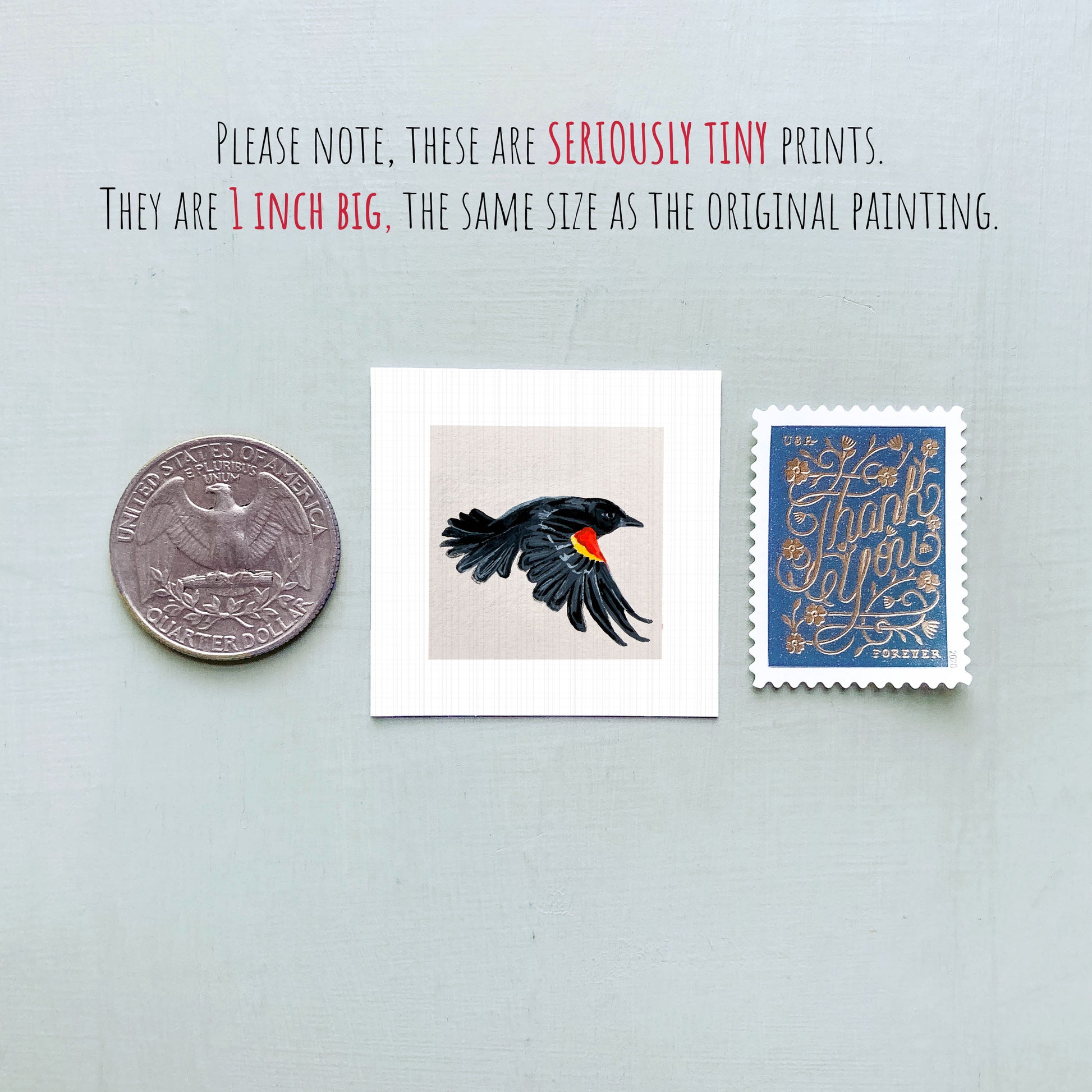 three small items: a quarter, a postage stamp, and a painting of a black bird.