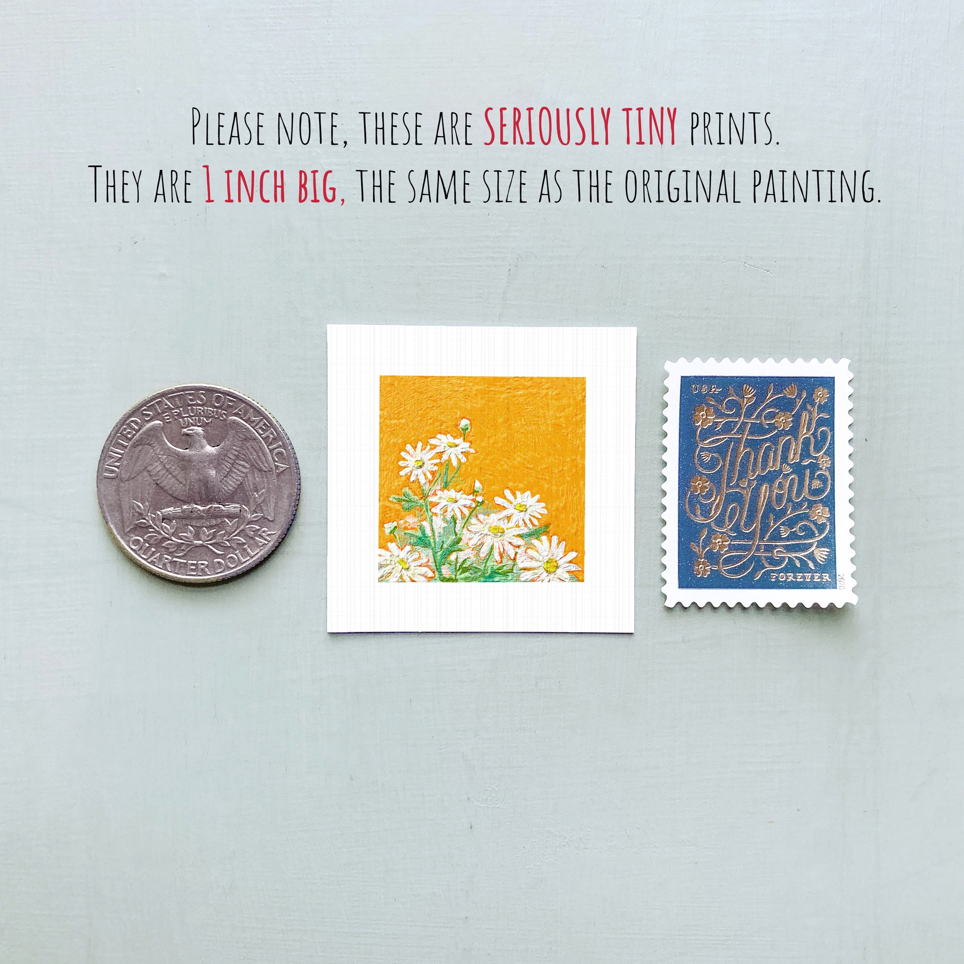 three small artworks: a silver coin, a white square with a floral design, and a blue postage stamp with gold lettering.