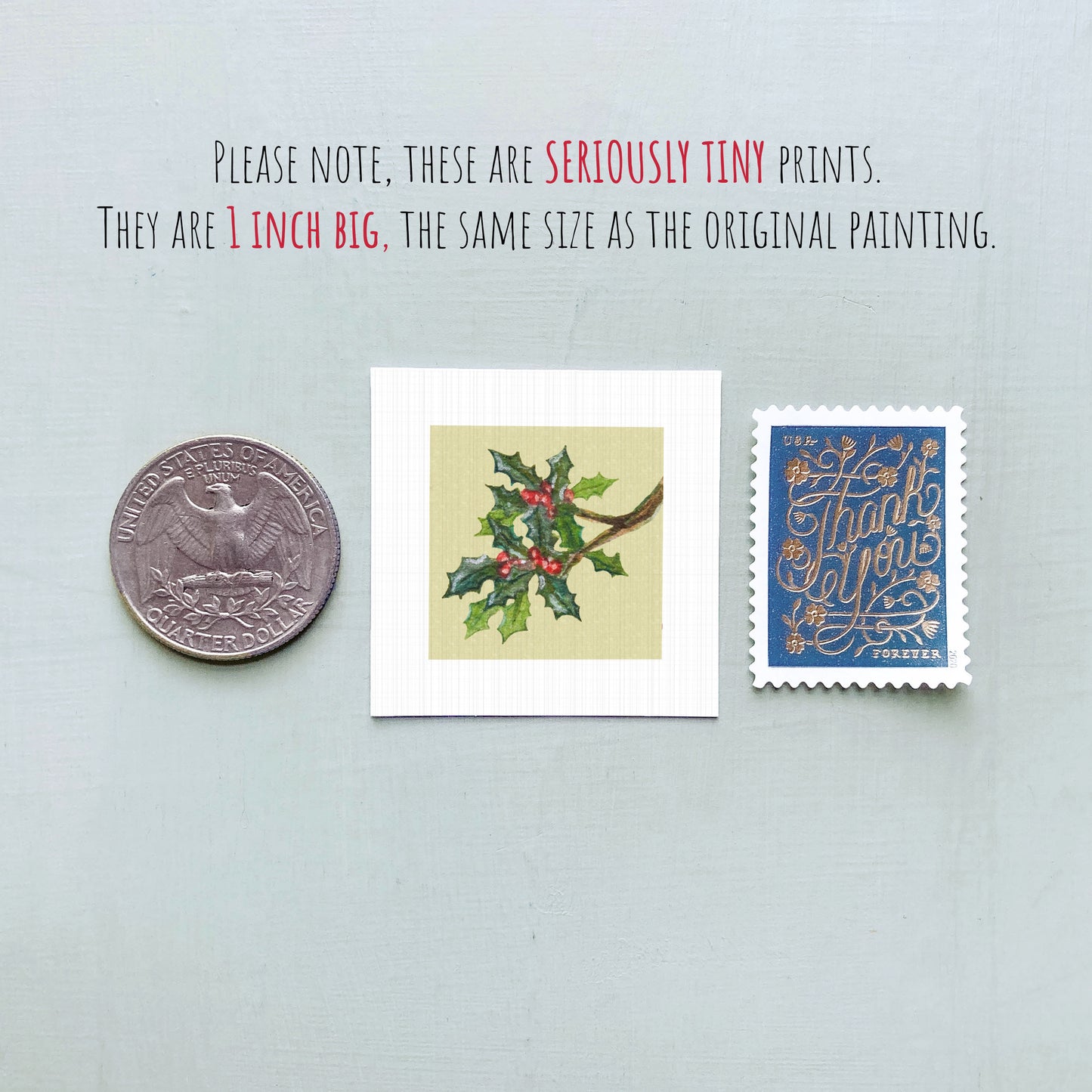 three small prints: a United States quarter, a square print of a holly leaf with berries, and a blue postage stamp with gold lettering.