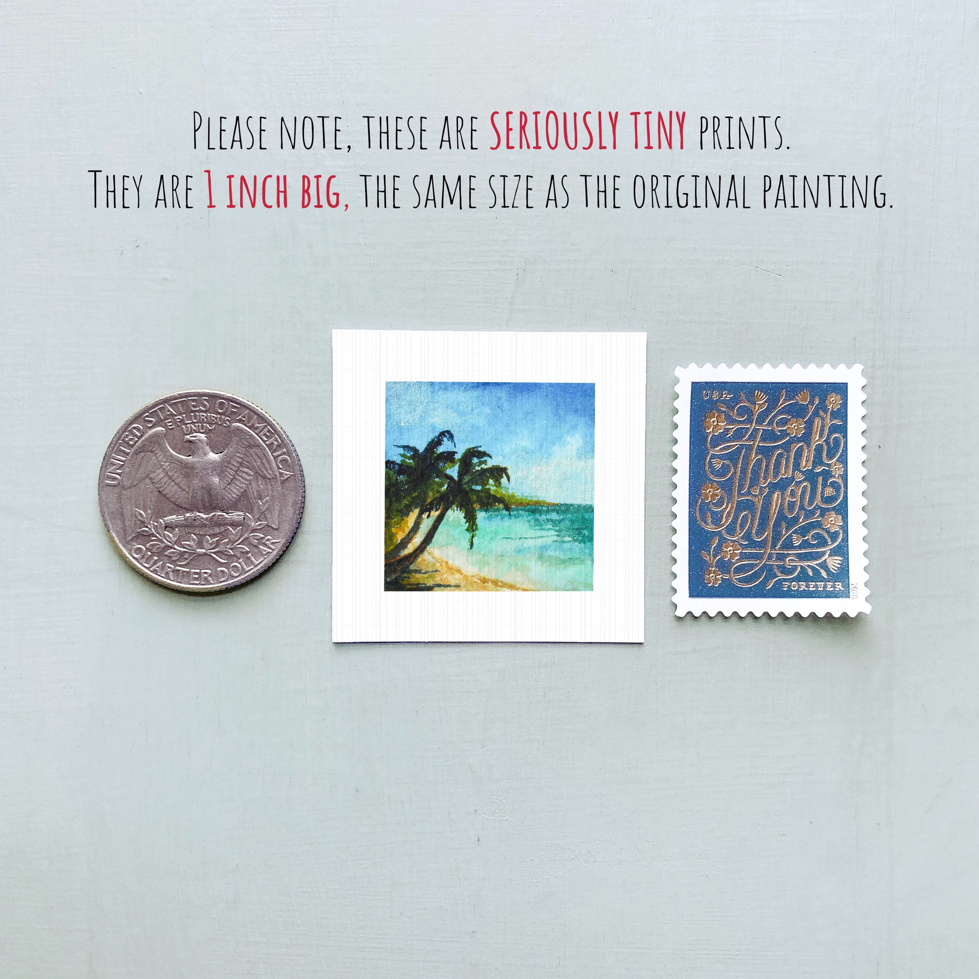 three small prints: a quarter, a square print of a tropical beach scene, and a blue postage stamp with gold lettering.