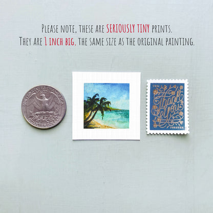 three small prints: a quarter, a square print of a tropical beach scene, and a blue postage stamp with gold lettering.