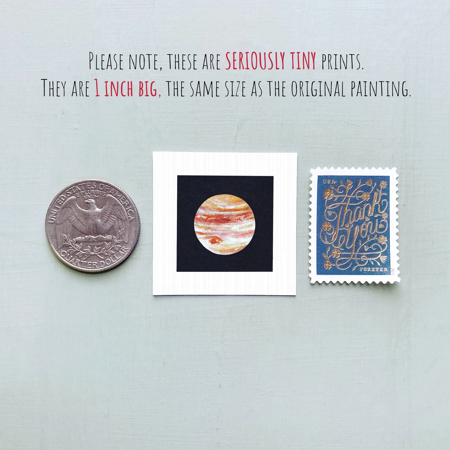 three small, seriously tiny prints: a United States quarter, a small square print with a planet image, and a blue postage stamp with gold lettering.