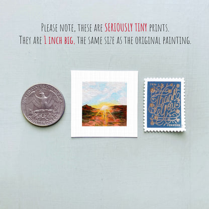 three small artworks and a United States quarter coin, all of which are described as "seriously tiny prints" and "1 inch big" in the provided text.