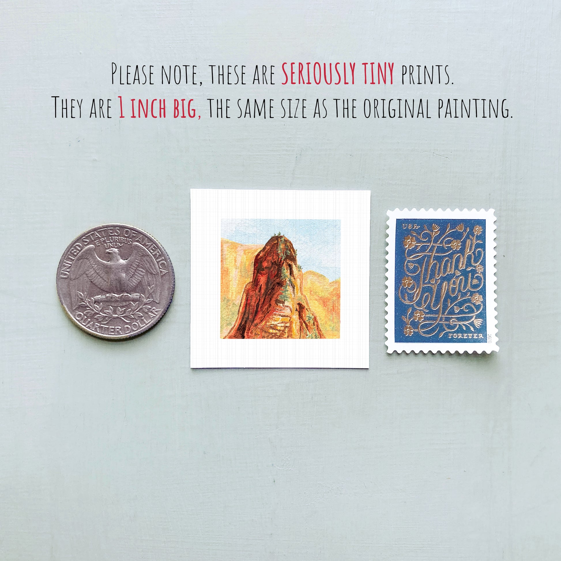 a collection of three small items: a quarter, a postage stamp, and a painting of a mountain.