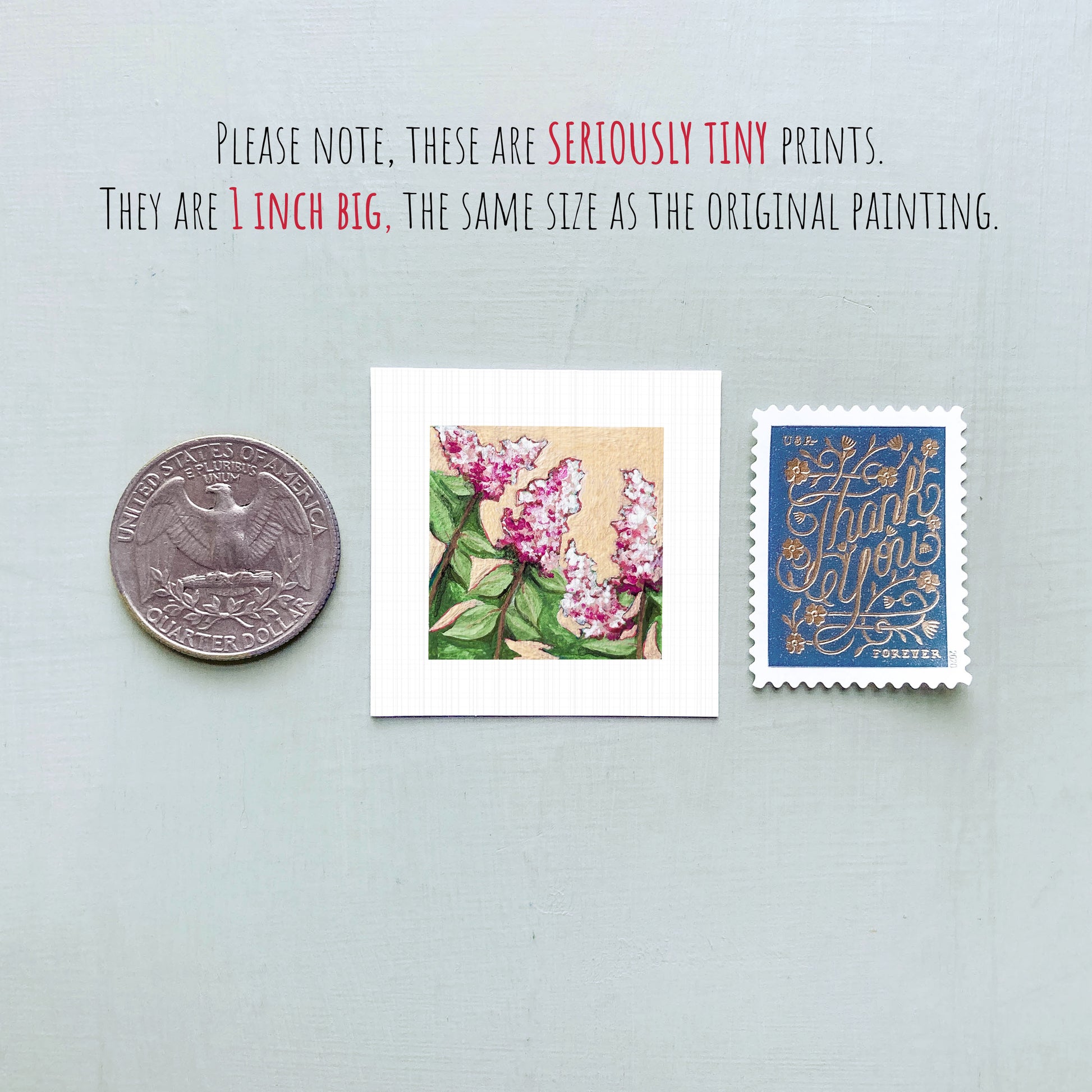 three small prints: a quarter, a square print of pink flowers, and a blue postage stamp with gold lettering.