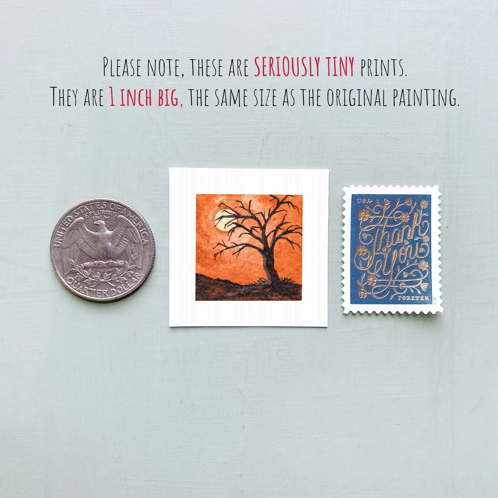 three small prints: a quarter, a square print of a tree with an orange background, and a blue postage stamp with gold lettering.