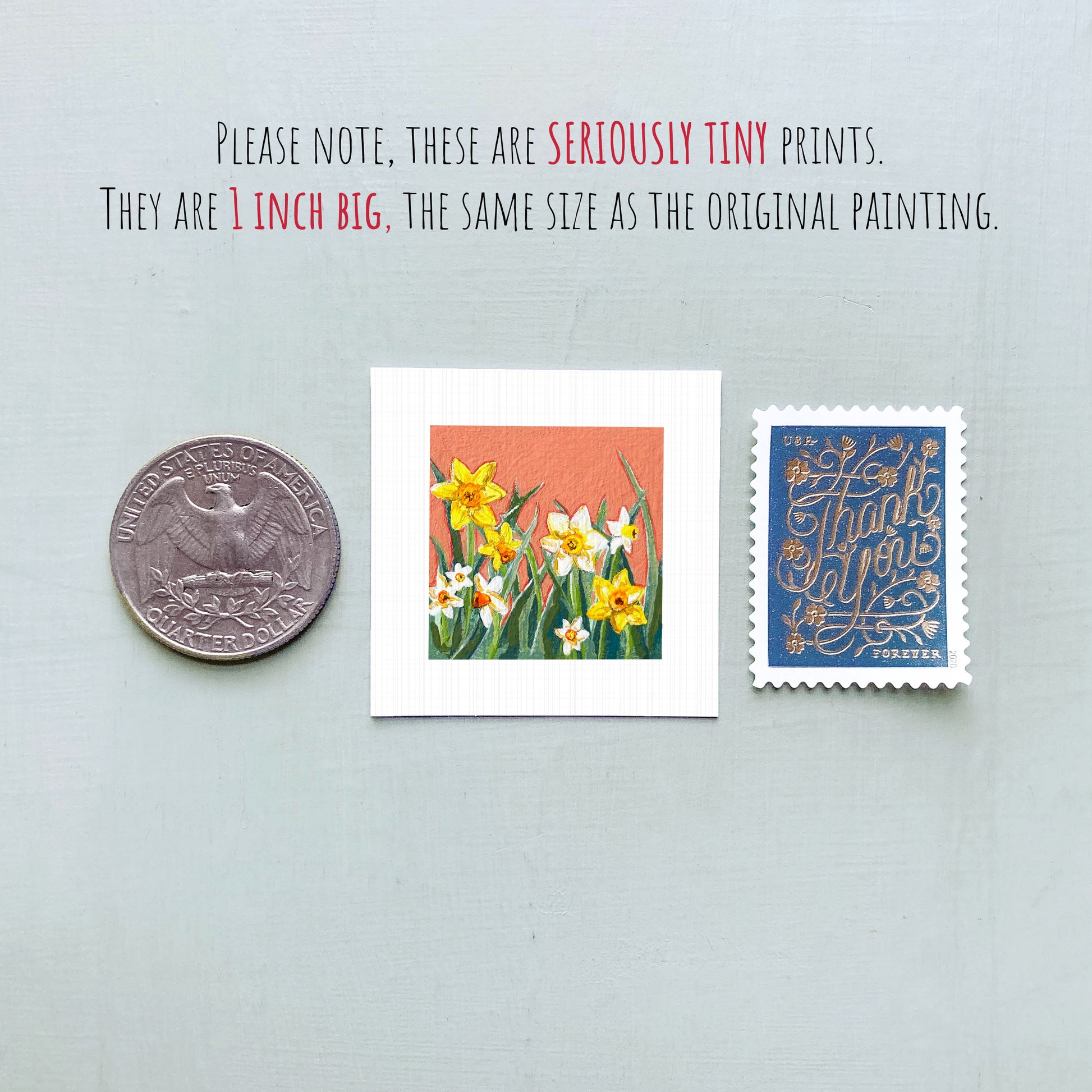 three small prints: a silver coin, a white square print of a flower, and a blue postage stamp.