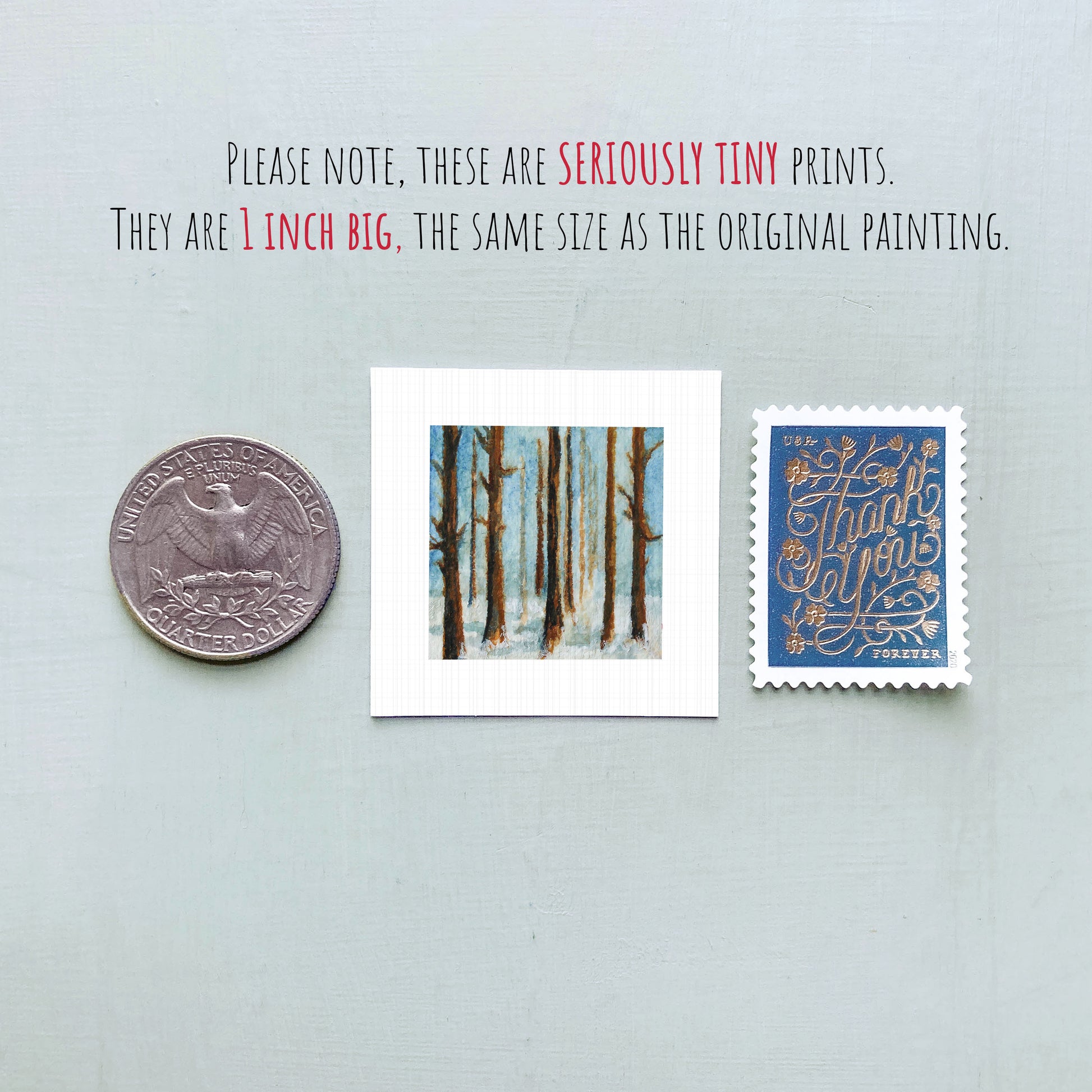 three small prints: a quarter, a square print of a painting of trees, and a postage stamp.