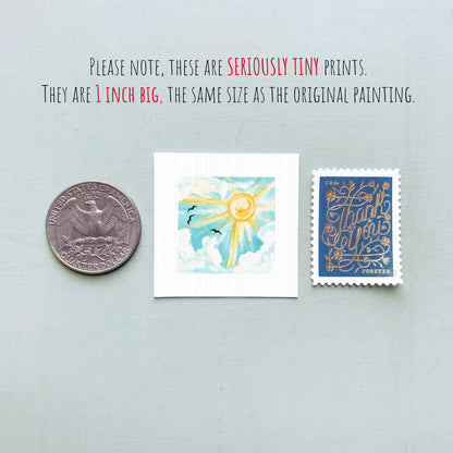 three small prints: a United States quarter, a square print with a sun and clouds, and a blue postage stamp with gold lettering.