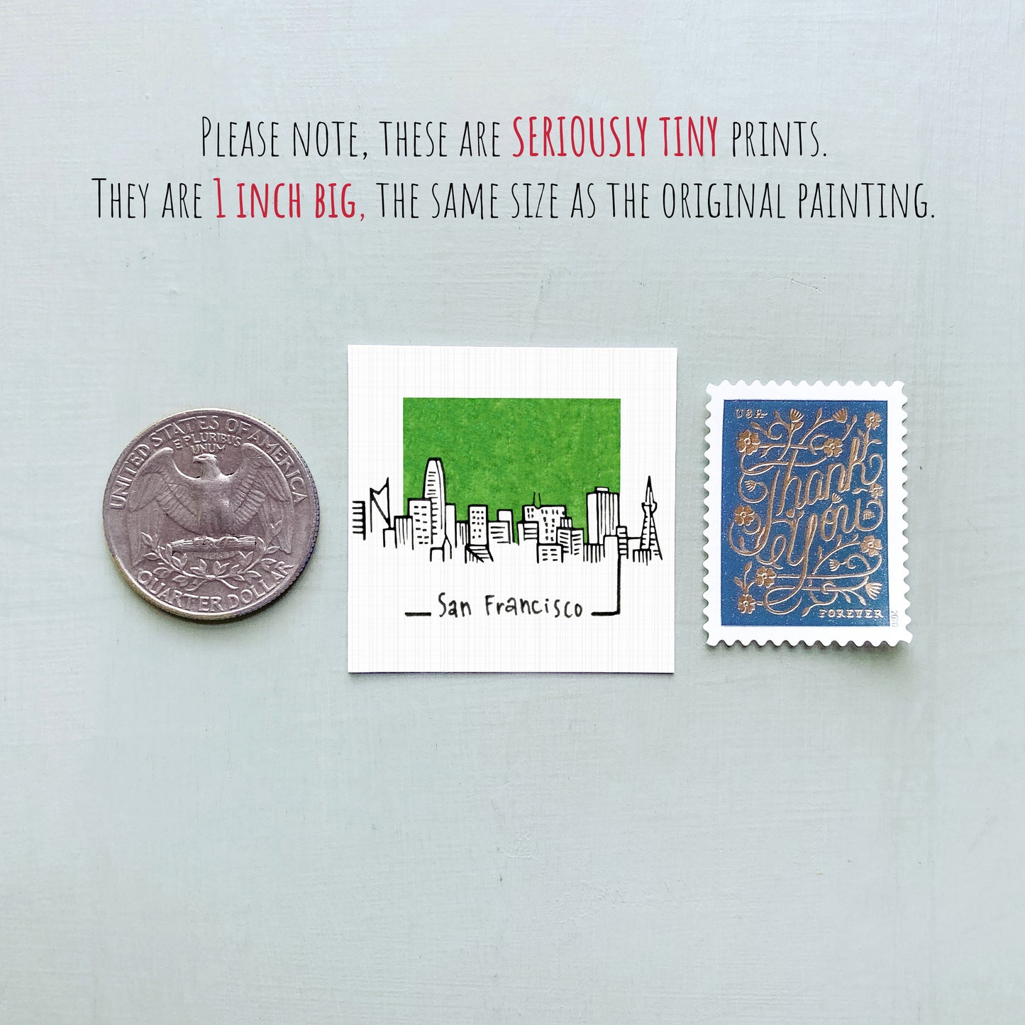 three small items: a quarter, a San Francisco postage stamp, and a postage stamp.