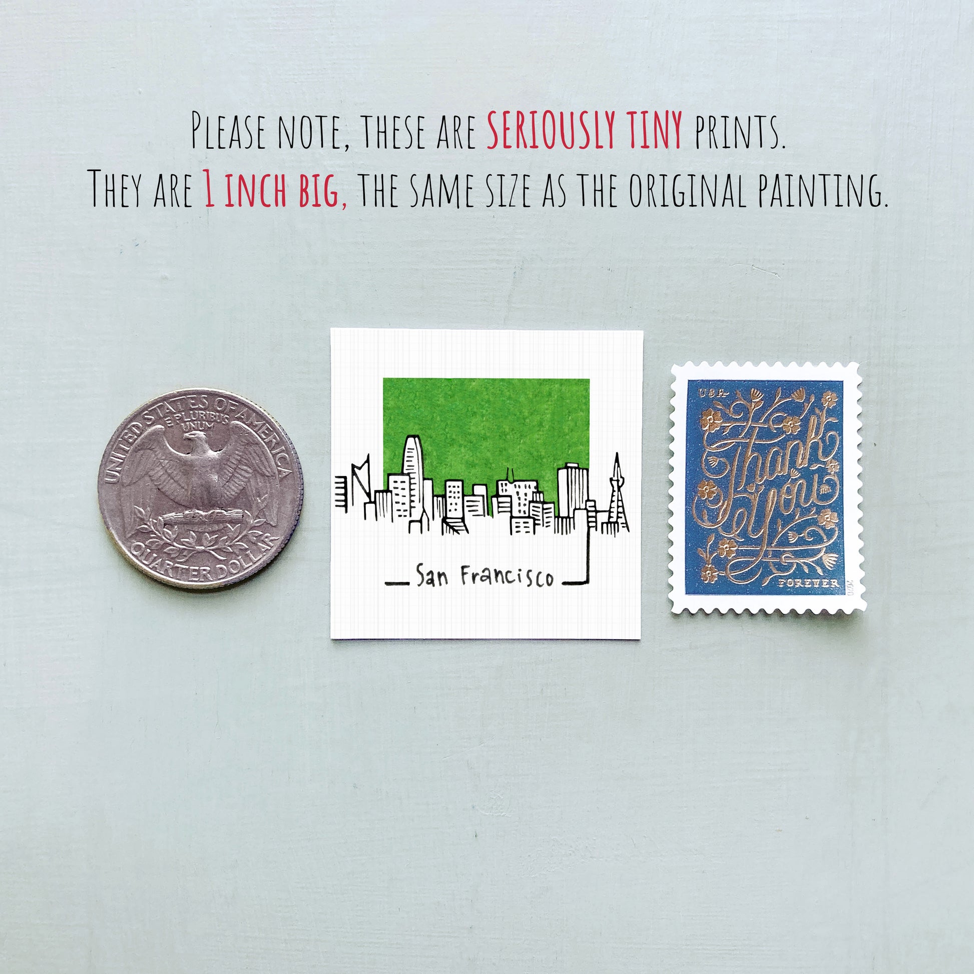 three small items: a quarter, a San Francisco postage stamp, and a postage stamp.