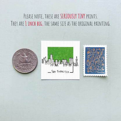 three small items: a quarter, a San Francisco postage stamp, and a postage stamp.