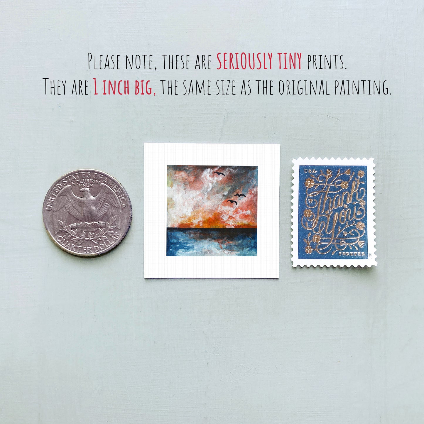three small artworks: a coin, a painting, and a postage stamp. The coin is 1 inch in size, the painting is 1 inch wide, and the postage stamp is 1 inch in width.