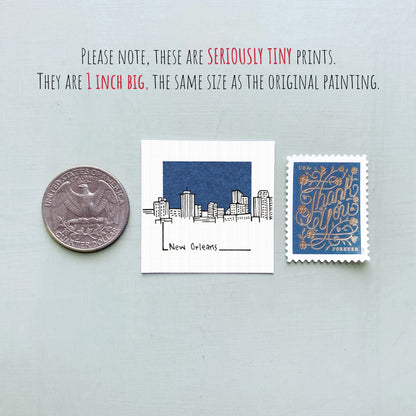three tiny prints: a quarter, a New Orleans postage stamp, and a New Orleans postage stamp.