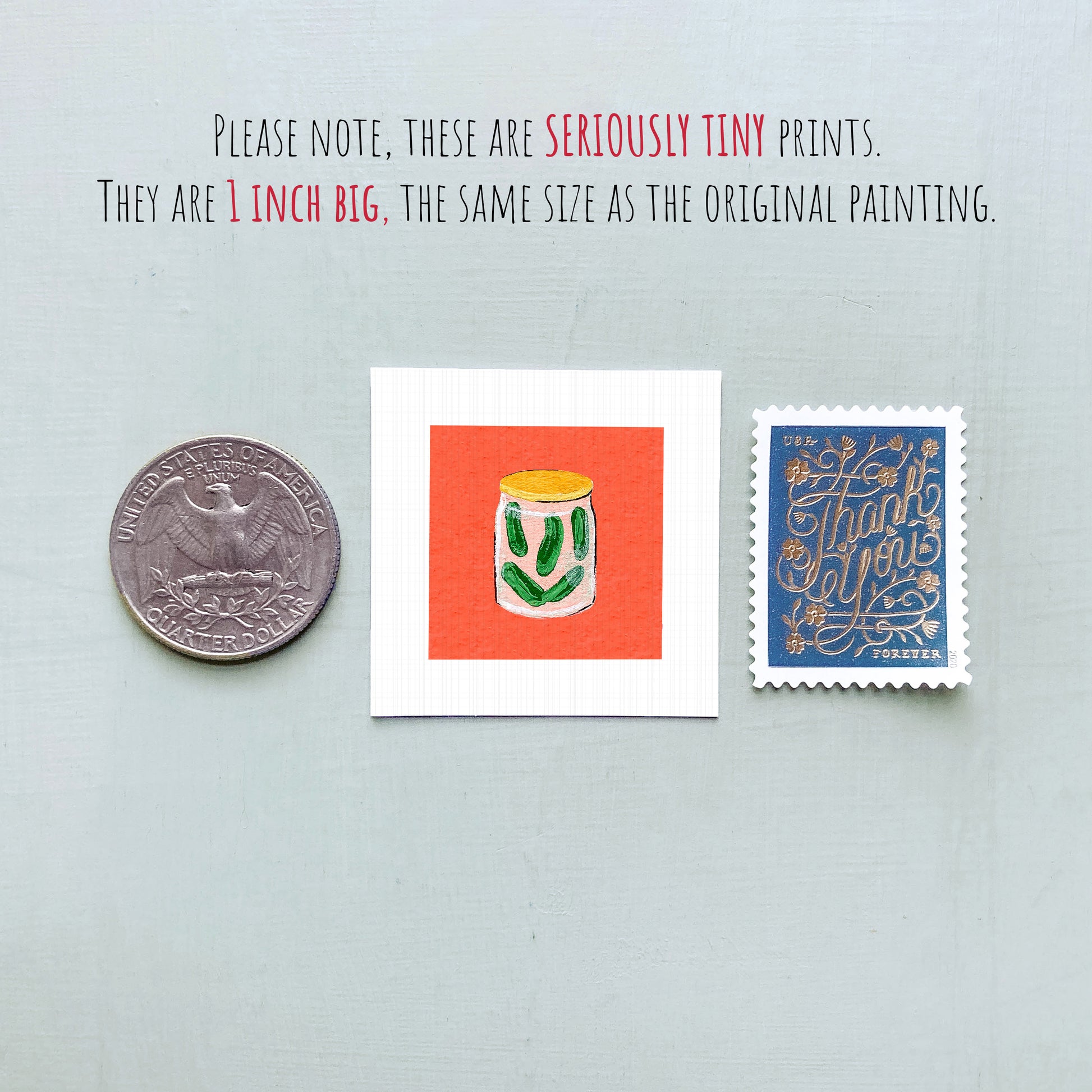 three small items: a quarter, a square with an illustration of a jar of pickles, and a postage stamp.