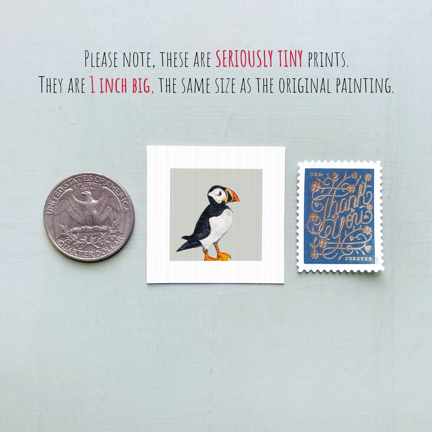a collection of three small items: a quarter, a postage stamp, and a painting of a bird.